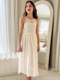 Front view of Isabelle dress showing lace sleeves and skirt flow