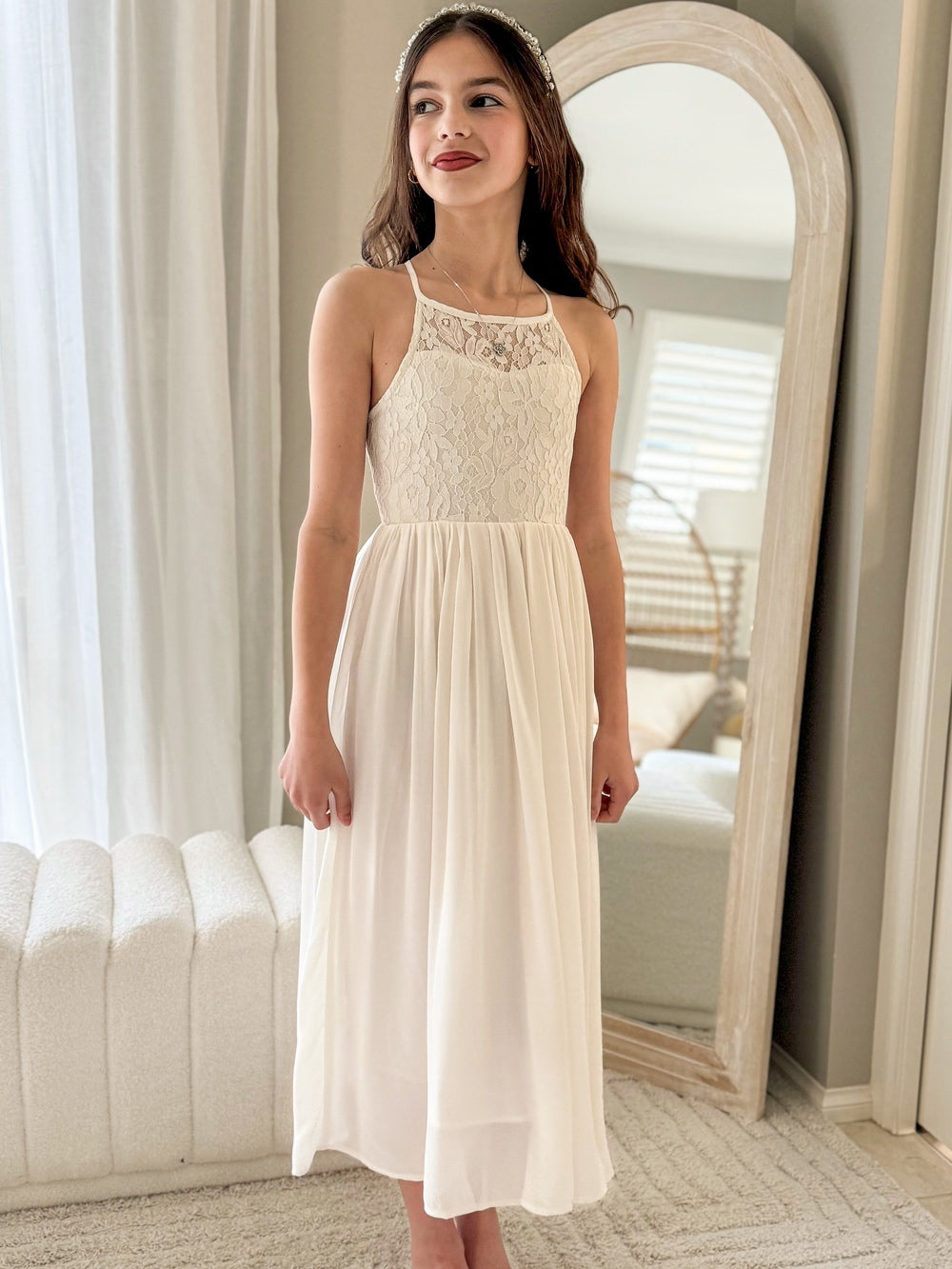 Front view of Isabelle dress showing lace sleeves and skirt flow