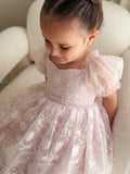 Light pink flower girl outfit with bows
Girls soft pink tulle dress for birthdays