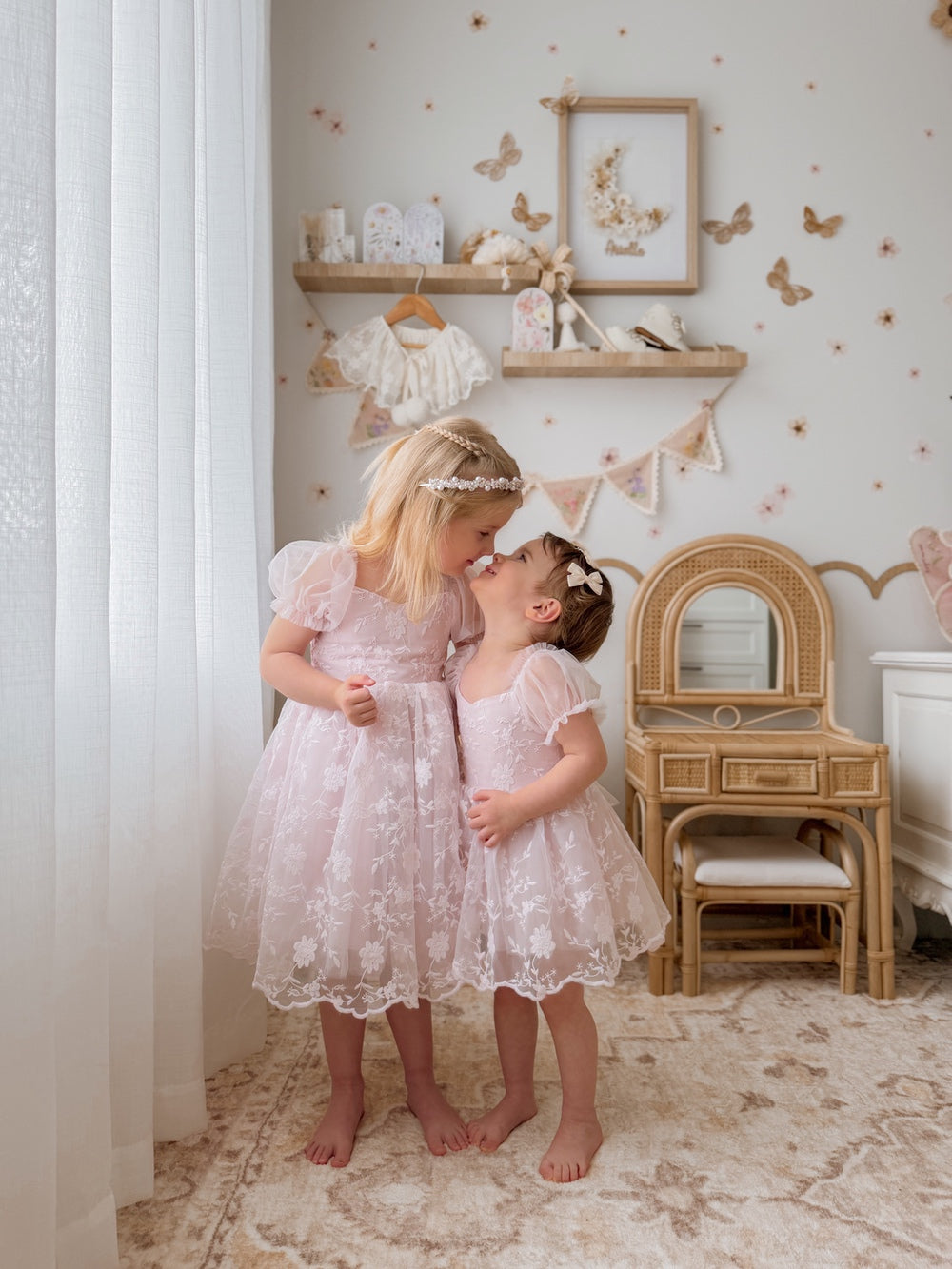 Light pink baby celebration dress with floral lace bodice