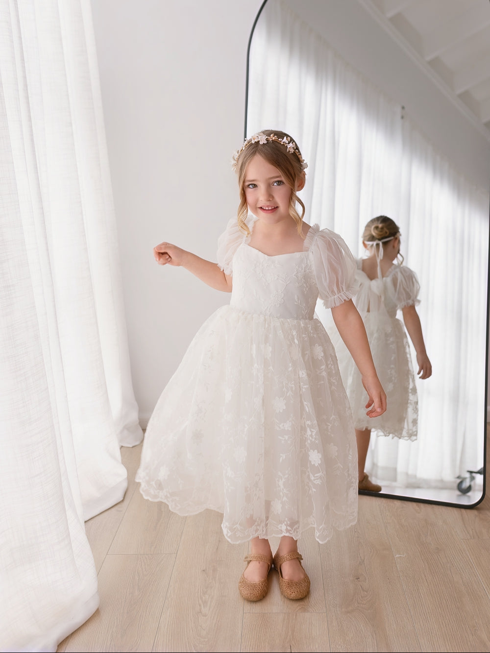 White lace flower girl dress for weddings modelled from the front