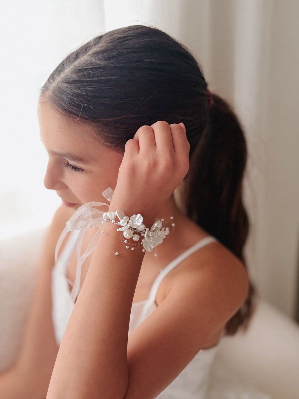 Ivory pearl wrist corsage for girls