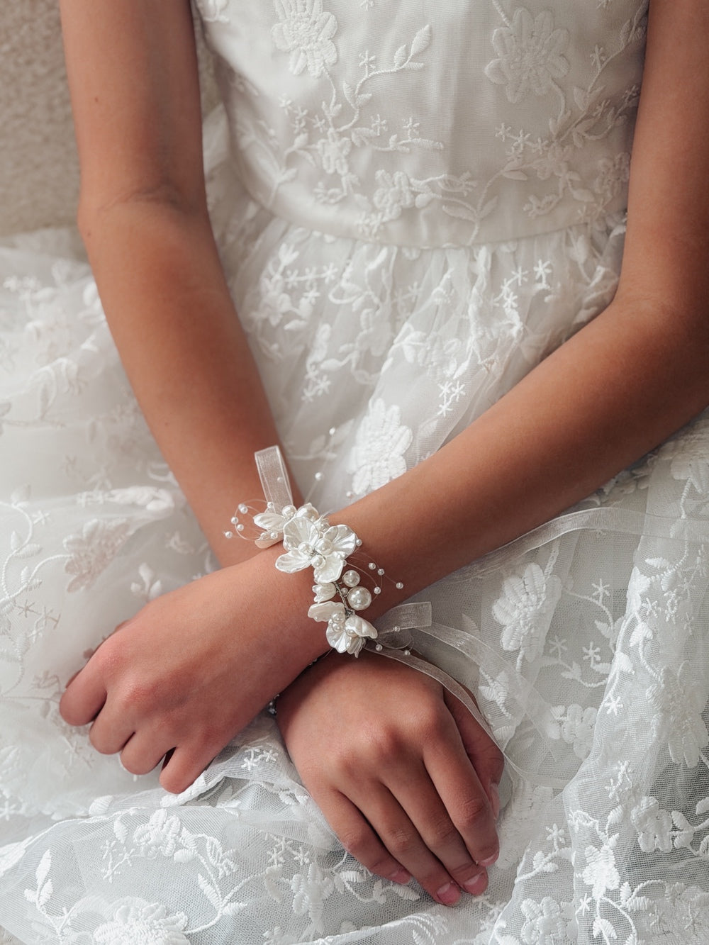 Ivory wrist corsage for First Communion