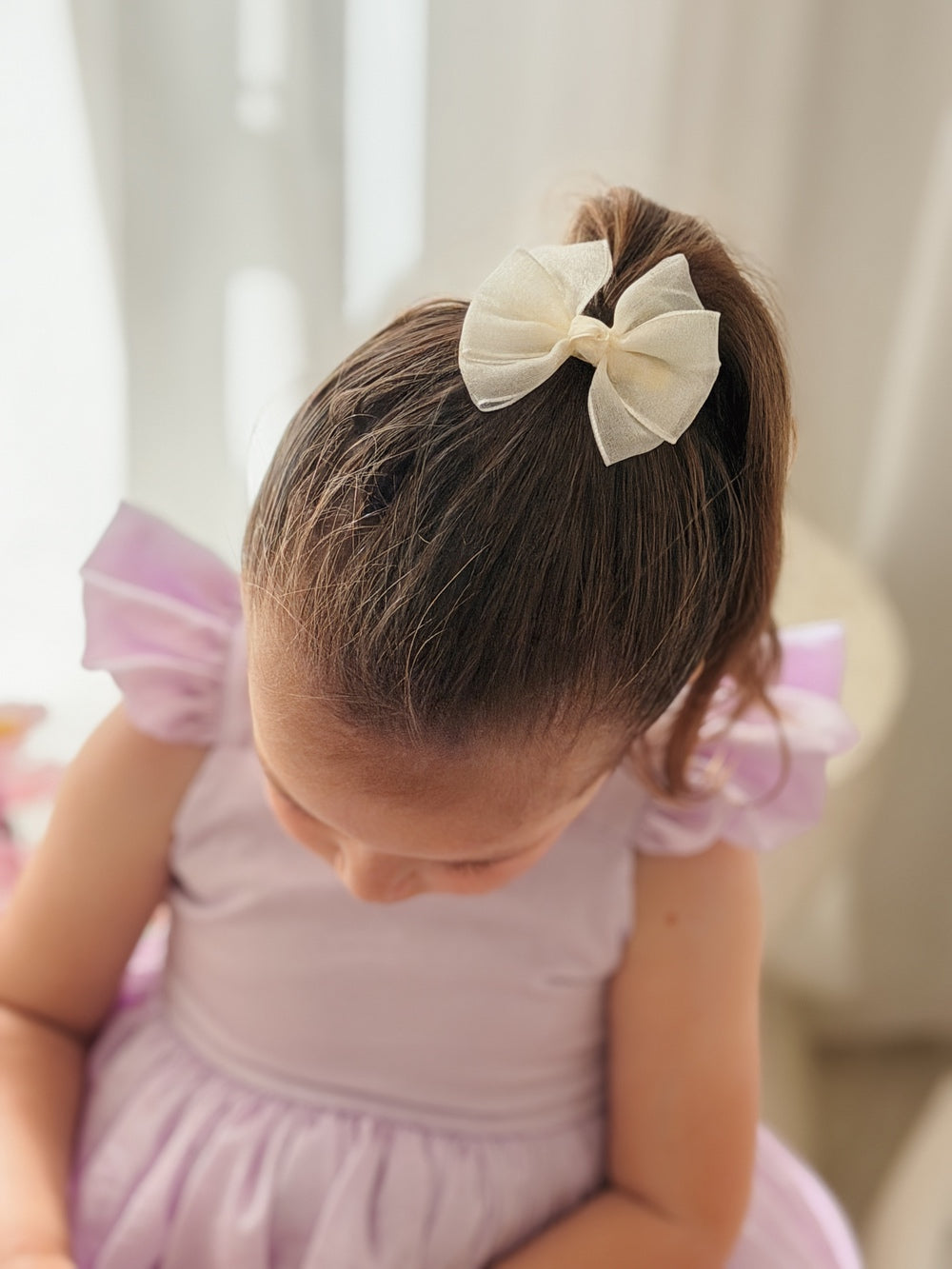 Ivory bow clips for pigtail hairstyles