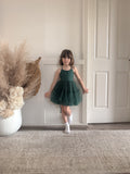 Full-length front view of the Juniper girls green dress with slim straps and a tiered tulle skirt.