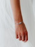 Girls bracelet with crystal-style flowers