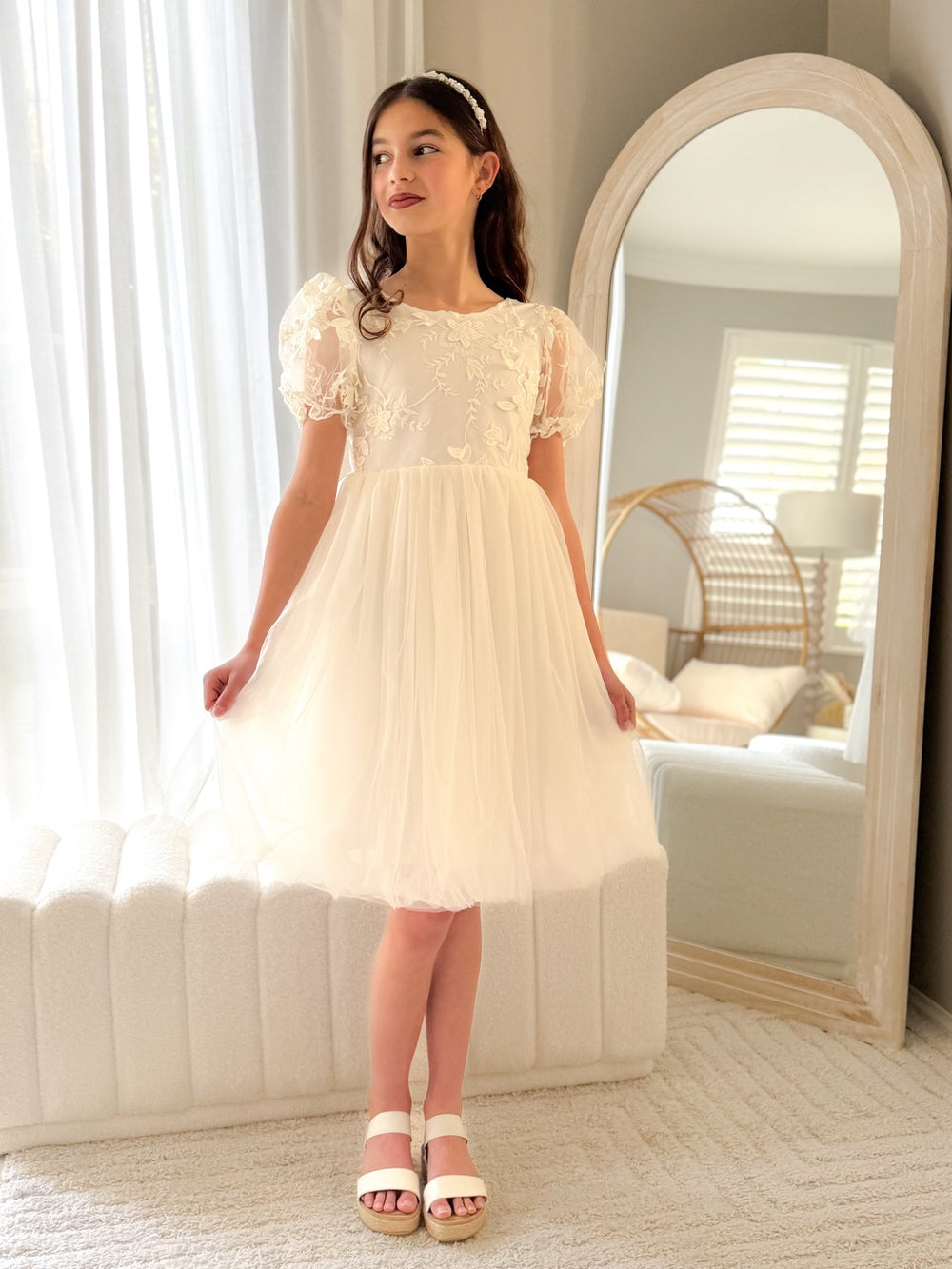Front view of Laura ivory flower girl dress with floral embroidery and puff sleeves