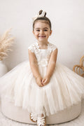 Ivory flower girls dress with lace and flowers