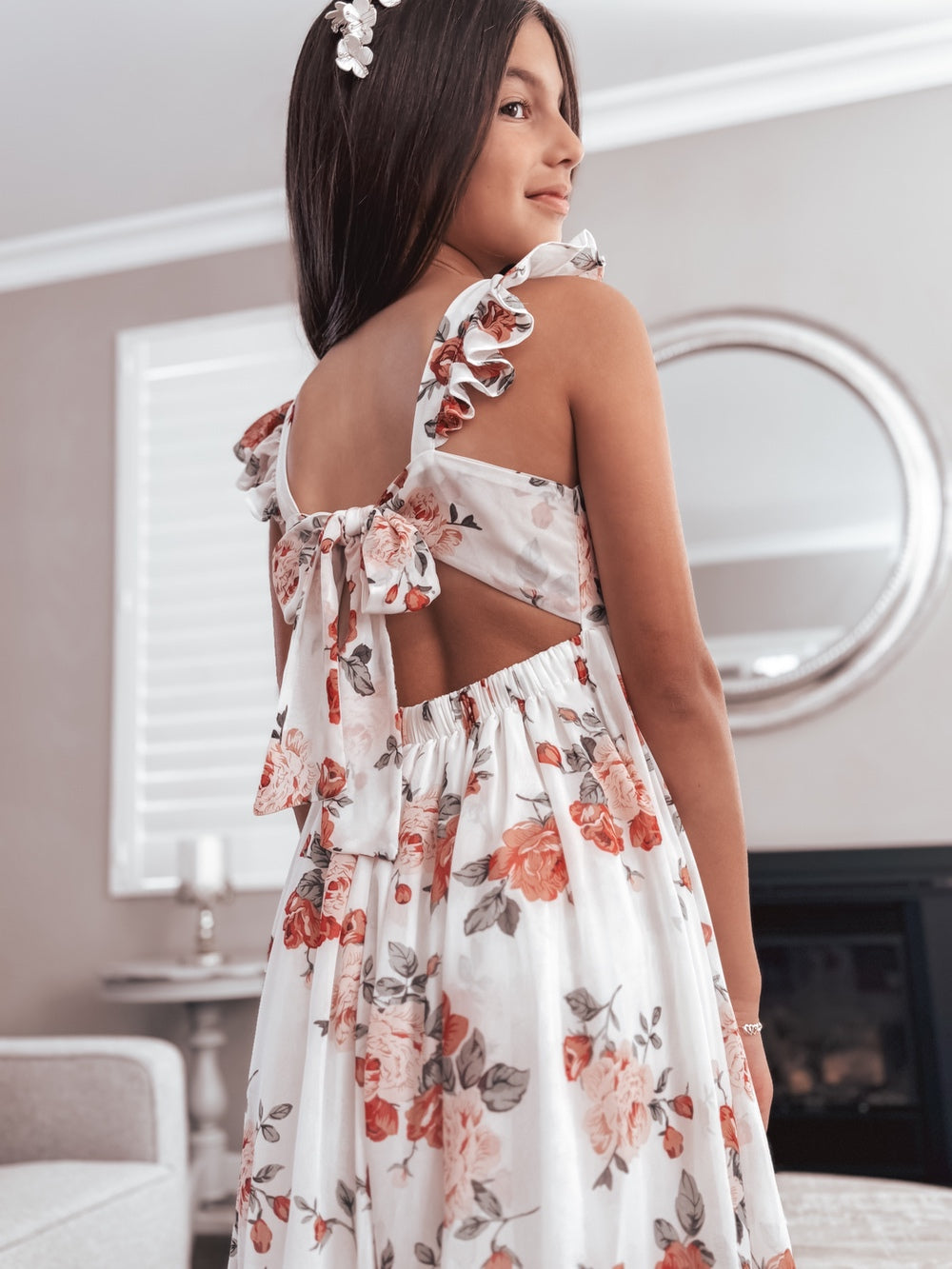 Back view of Leilani girls red and pink rose print dress with tie-up detail