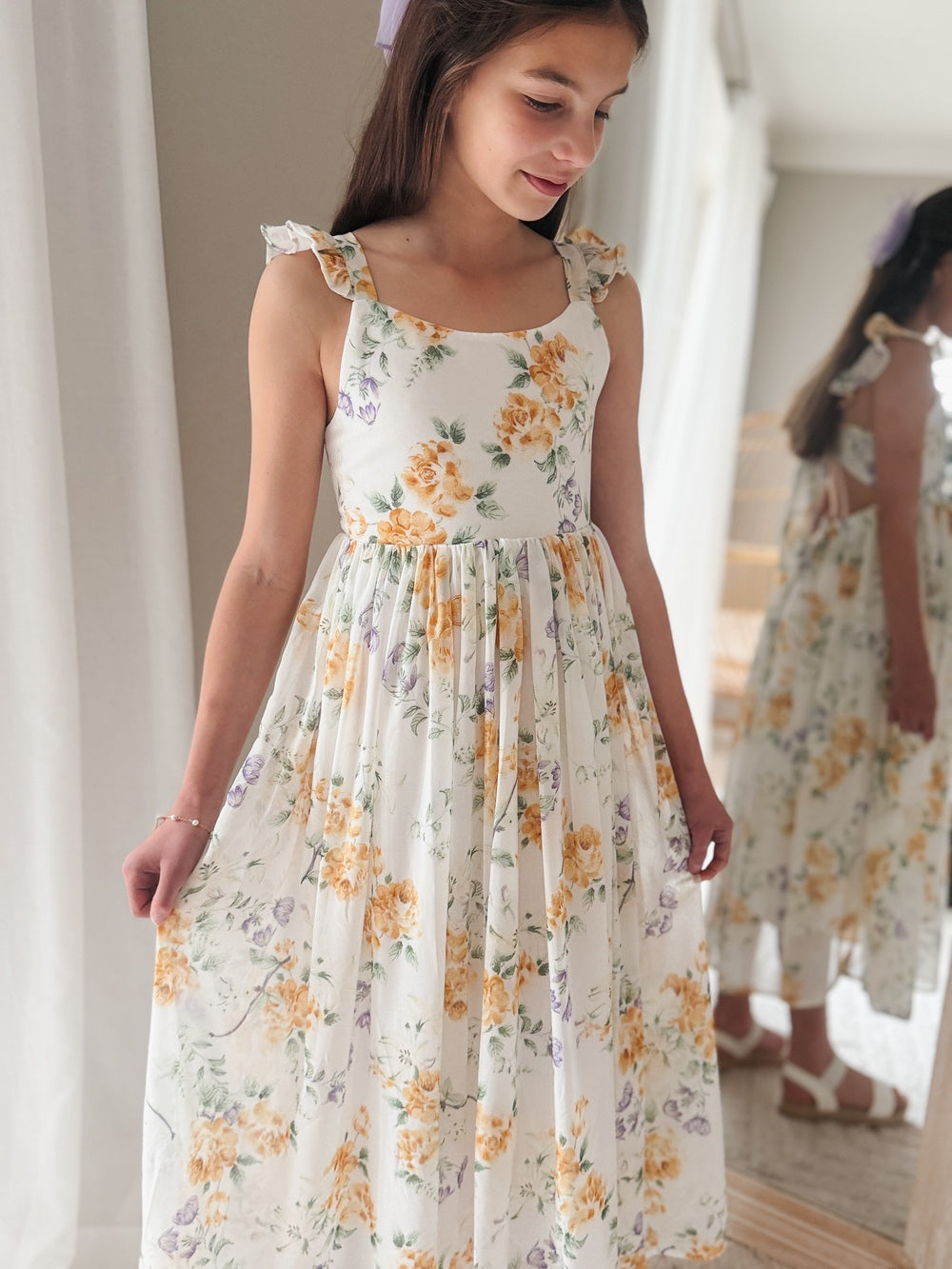 Front view of Leilani Girls Spring Floral Dress – soft floral print with ruffle shoulders