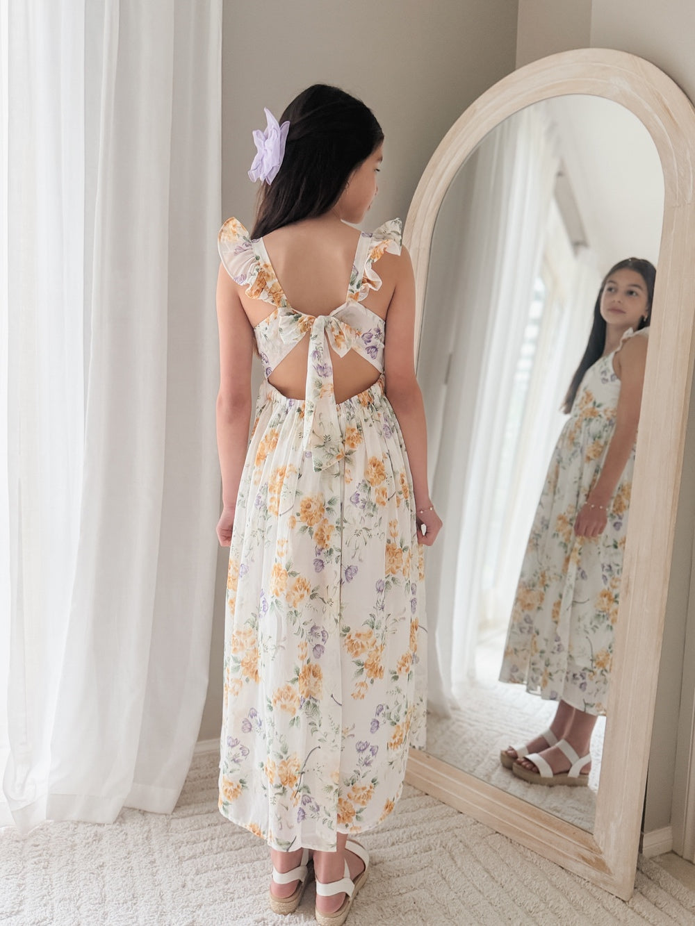 Sienna wearing Leilani Girls Spring Floral Dress – elegant tea-length design