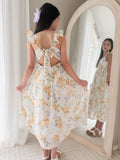 Back view of Leilani Girls Spring Floral Dress showing adjustable tie-up back