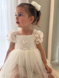 Close-up of embroidered bodice – Lila Ivory Baby Dress with floral detailing