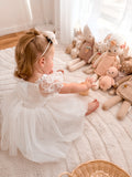 Lila Embroidered Girls Dress in white with puff sleeves