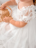 white girls dress with puff sleeves and tulle bow