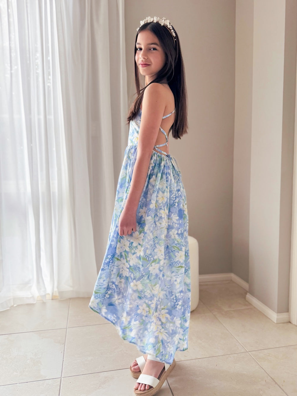 Light blue floral high-low dress showing movement from side angle