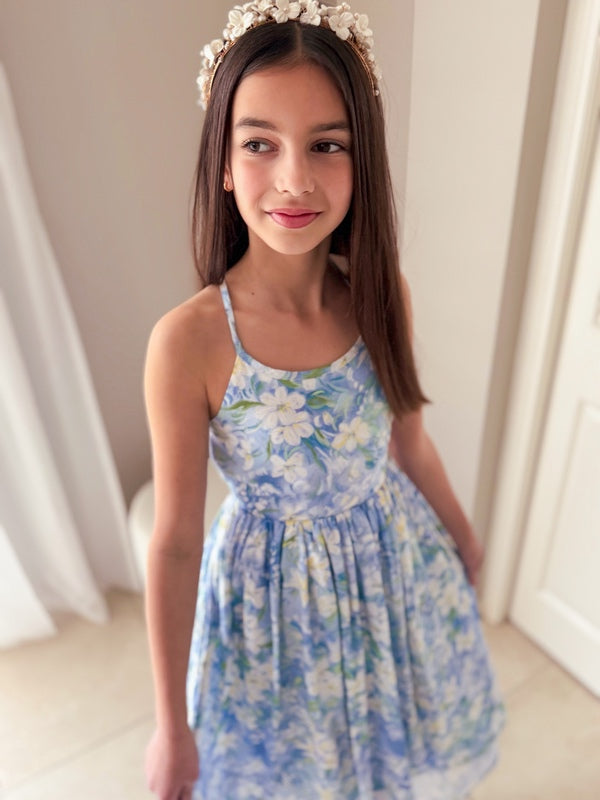 Light blue girls graduation dress with white and green floral print and high-low hem