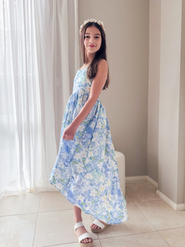 Bluebelle dress flowing mid-twirl in a summer lighting