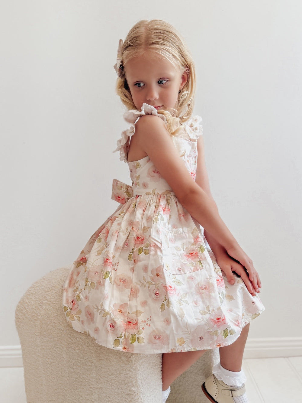 Detail of lace-trimmed pockets on Lucinda Girls Floral Cotton Dress