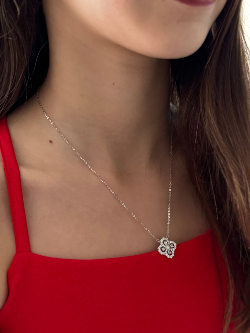 Girl wearing silver clover necklace—Lucky Charm jewellery