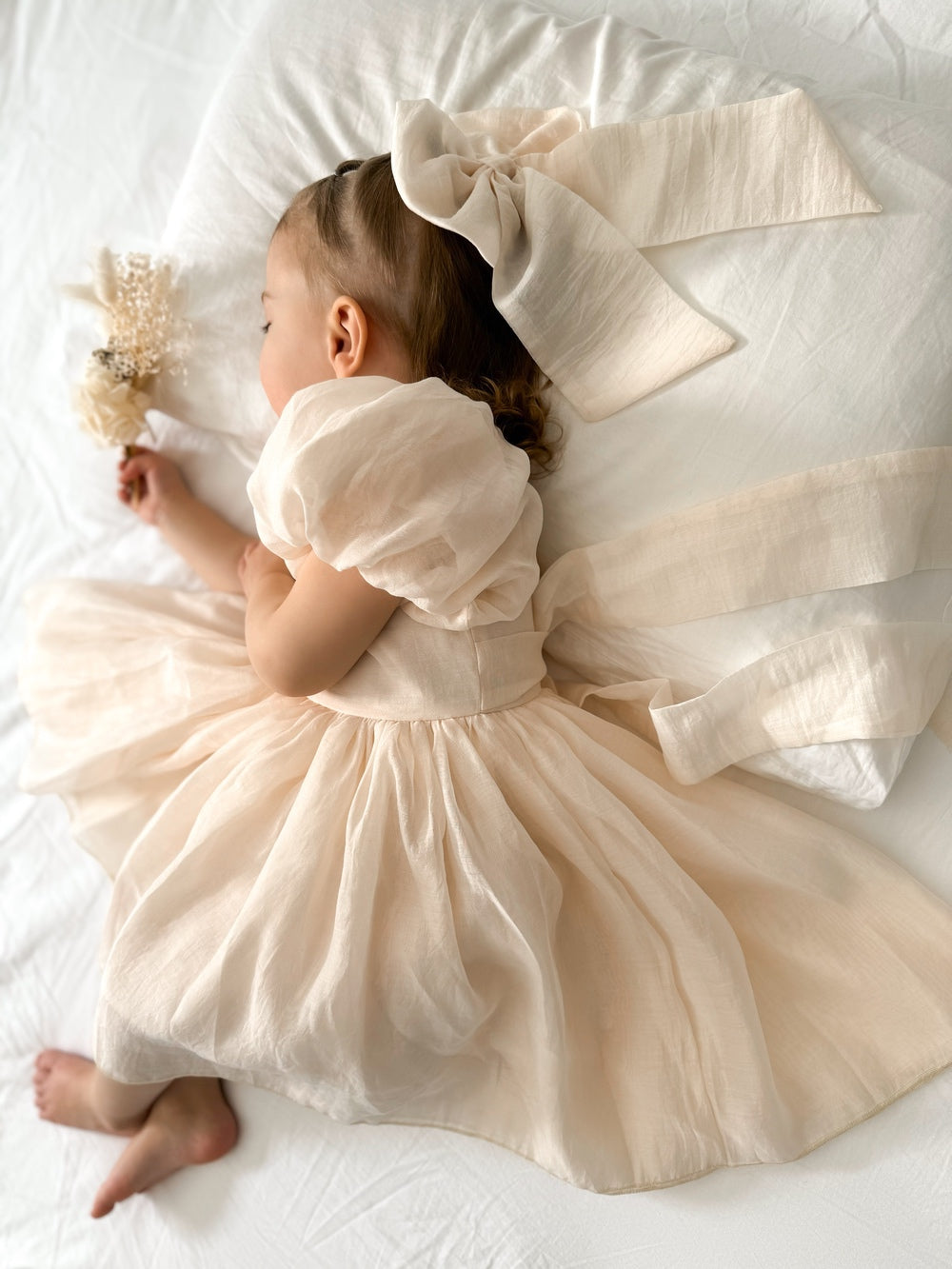 Champagne flower girl dress for babies with elegant bow back design