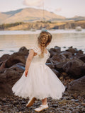 Girls mid-length lace dress for weddings and special occasions