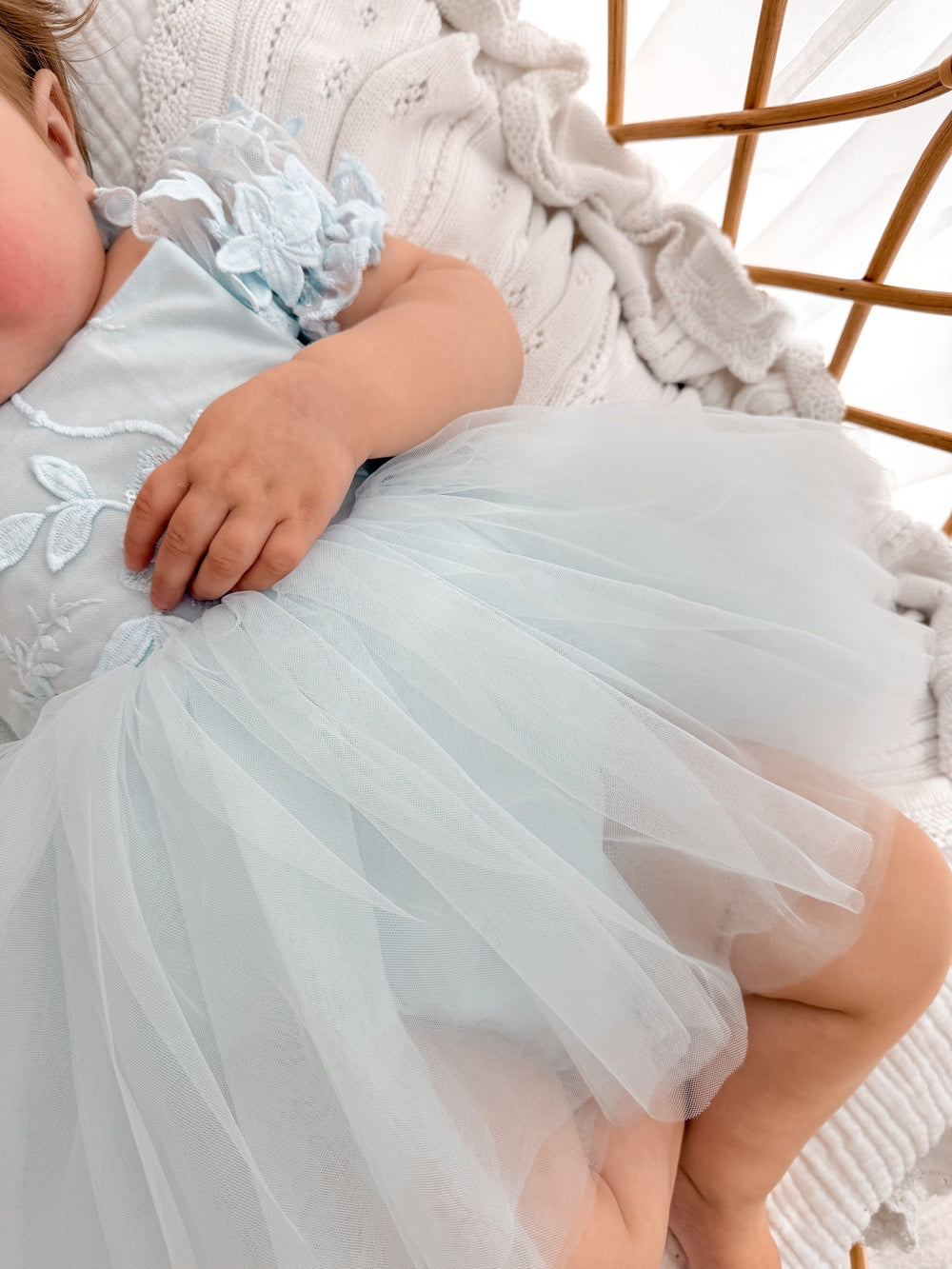 Lila dusty blue embroidered baby dress, tulle skirt detail.