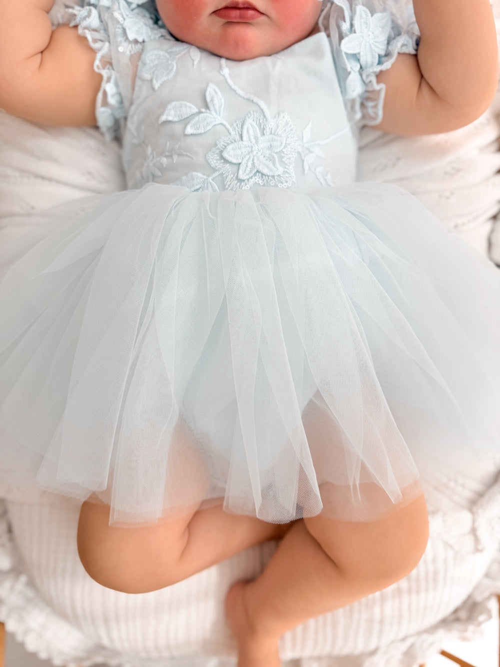 Lila dusty blue baby dress, floral bodice and skirt detail.