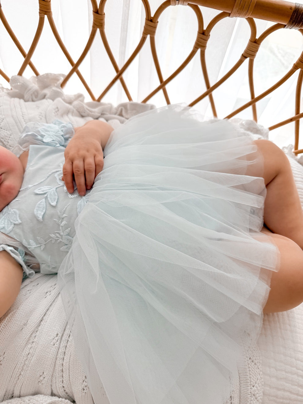 Lila dusty blue baby dress, layered tulle skirt close-up.