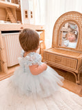 Lila dusty blue tulle baby dress, rear view.