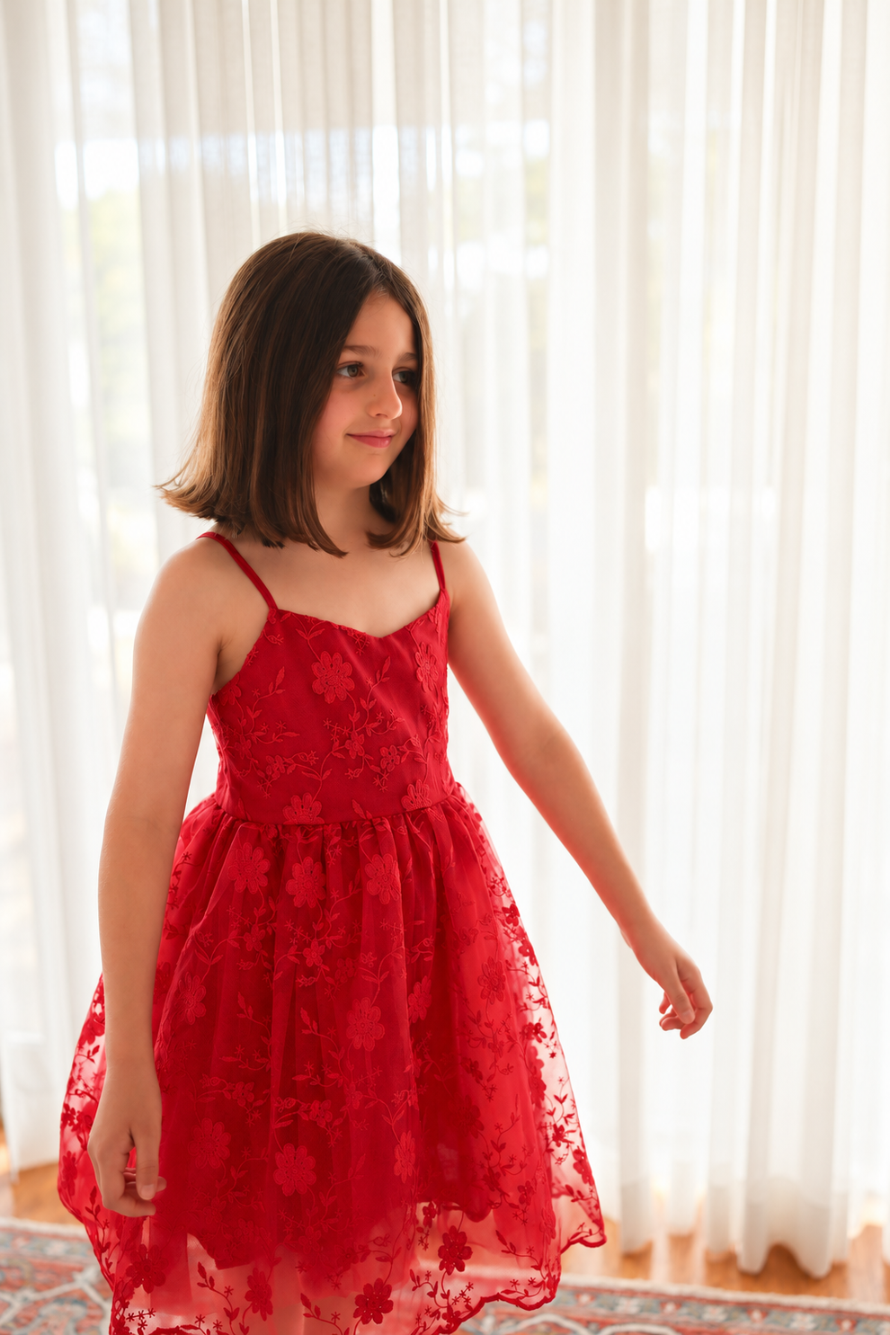 Lucia red embroidered girls Christmas dress, front view and scalloped hem.