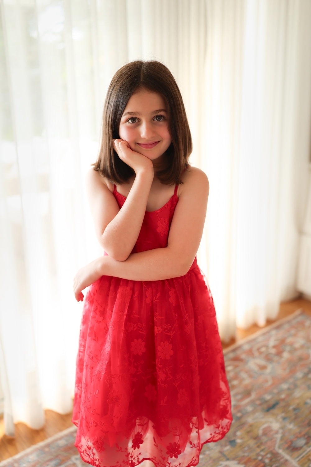 Lucia red embroidered girls dress, floral bodice detail.