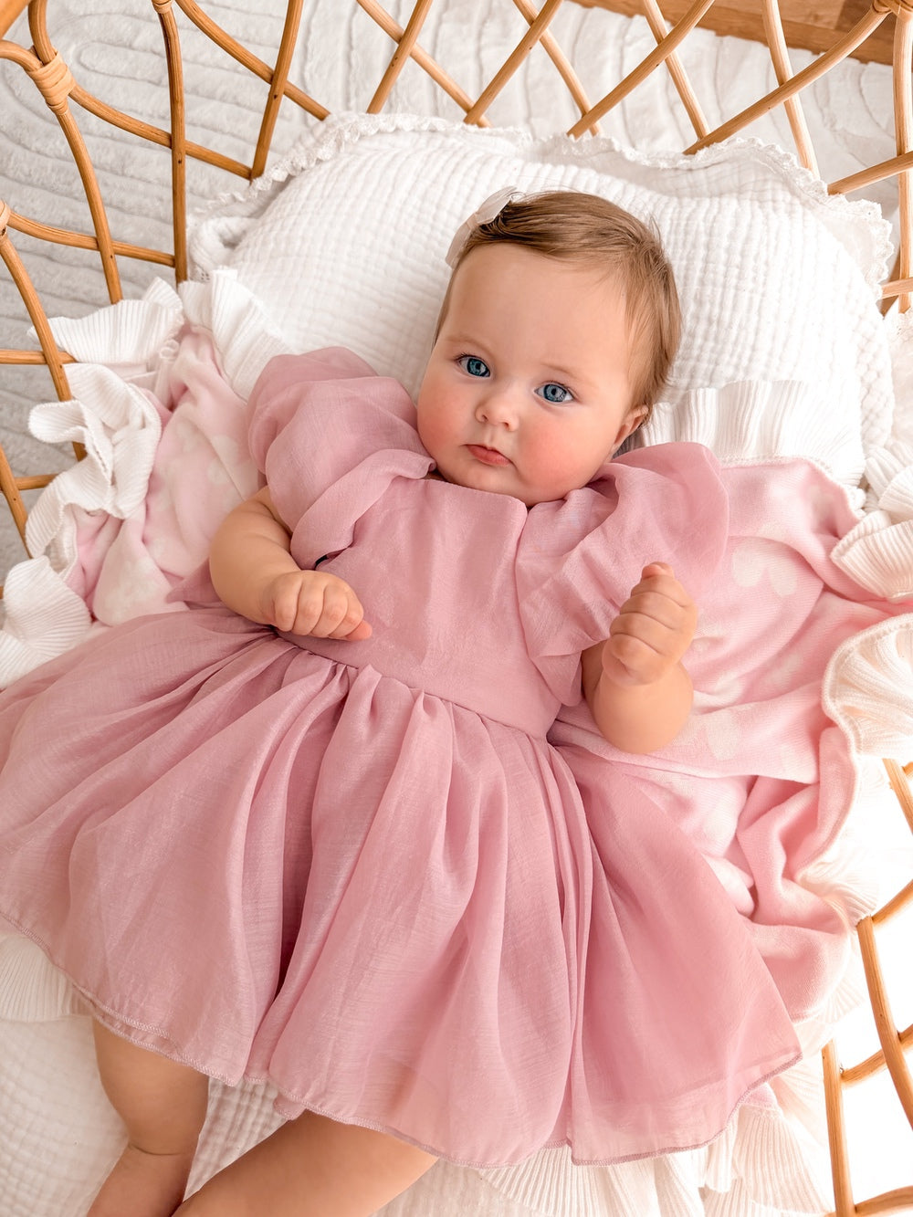 Soft dusty pink baby dress with sweet puff sleeves