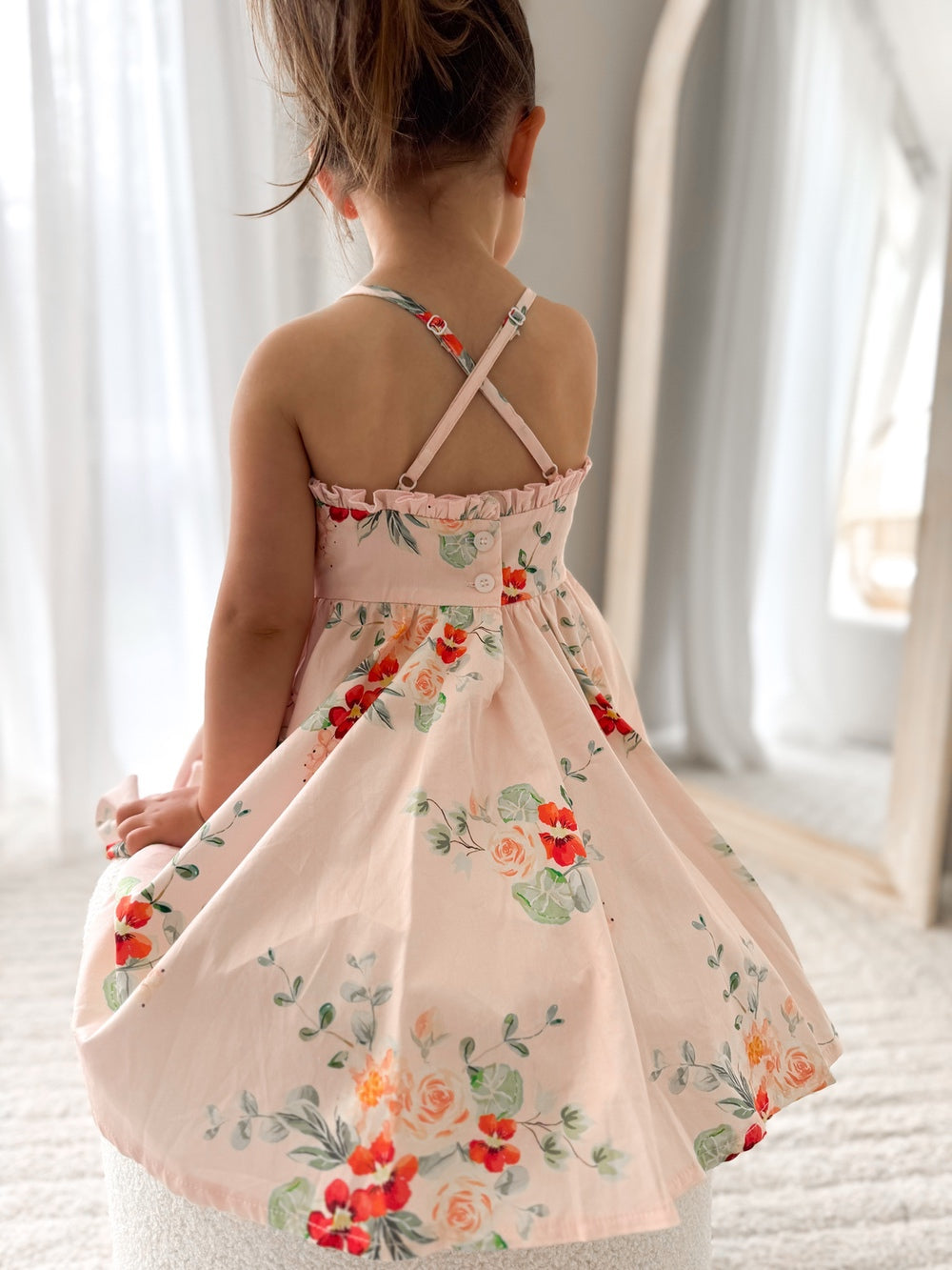 Marley Girls Christmas Dress - Christmas Dresses and RompersClose-up of the Marley Girls Floral Christmas Dress showing the fine red flower print and soft 100% cotton.