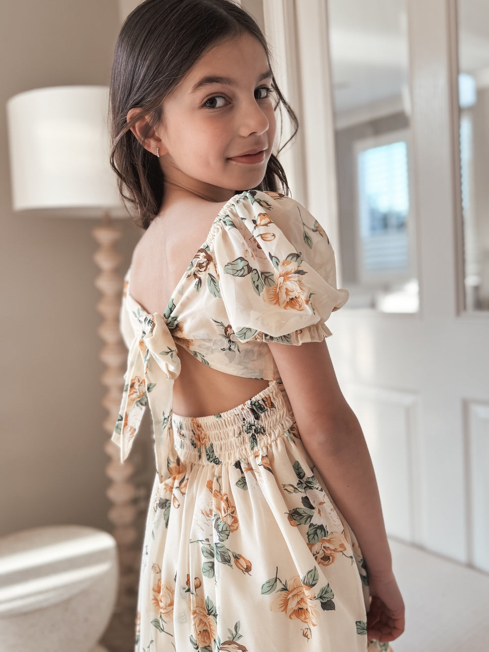 Girl in floral dress on sale