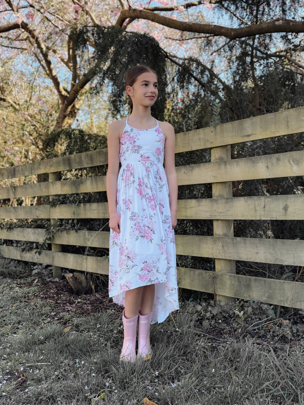 Soft floral print dress with high‑low hem and delicate straps in front
