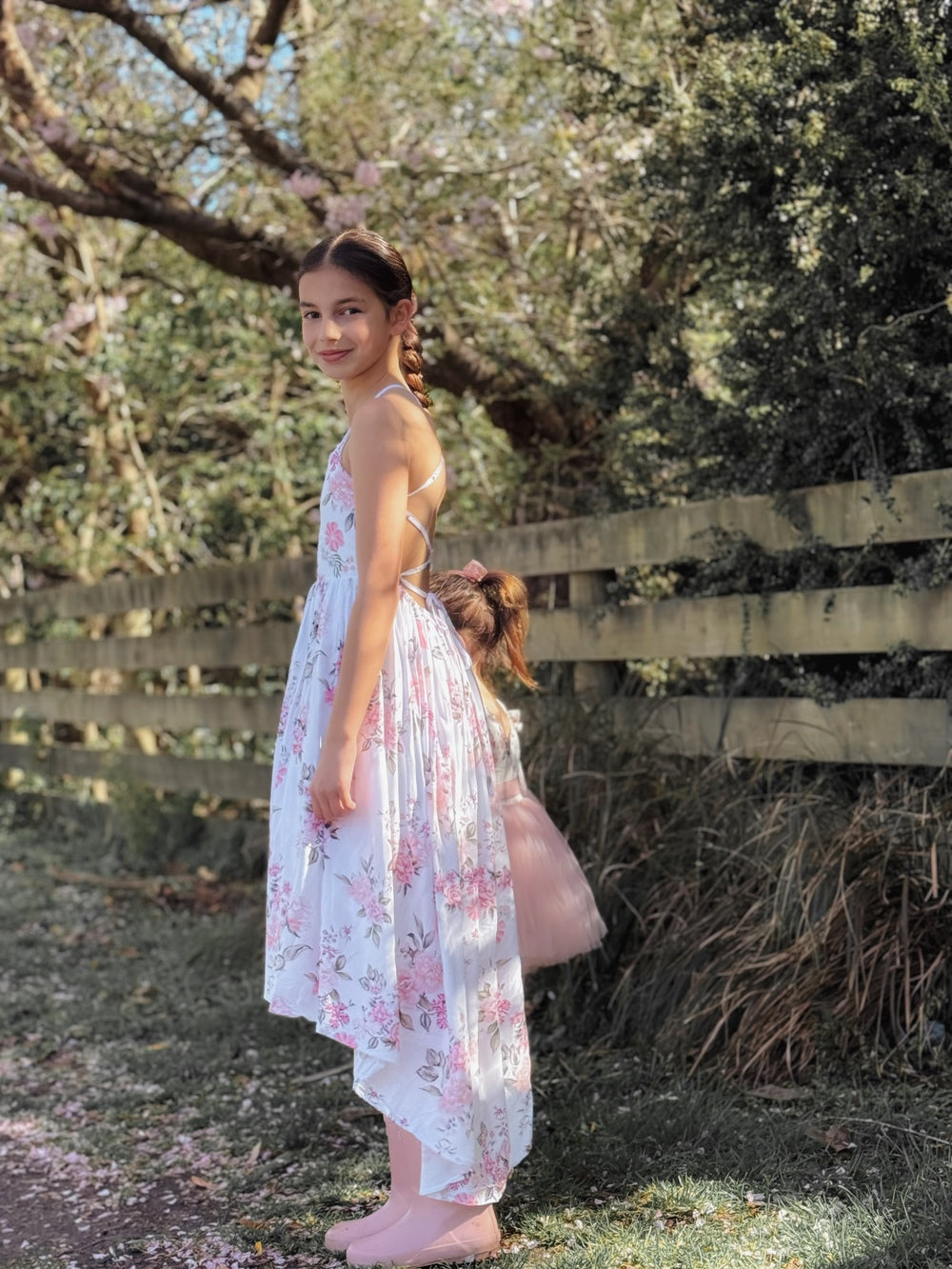 Side view of flowy skirt in Meadow floral dress during motion