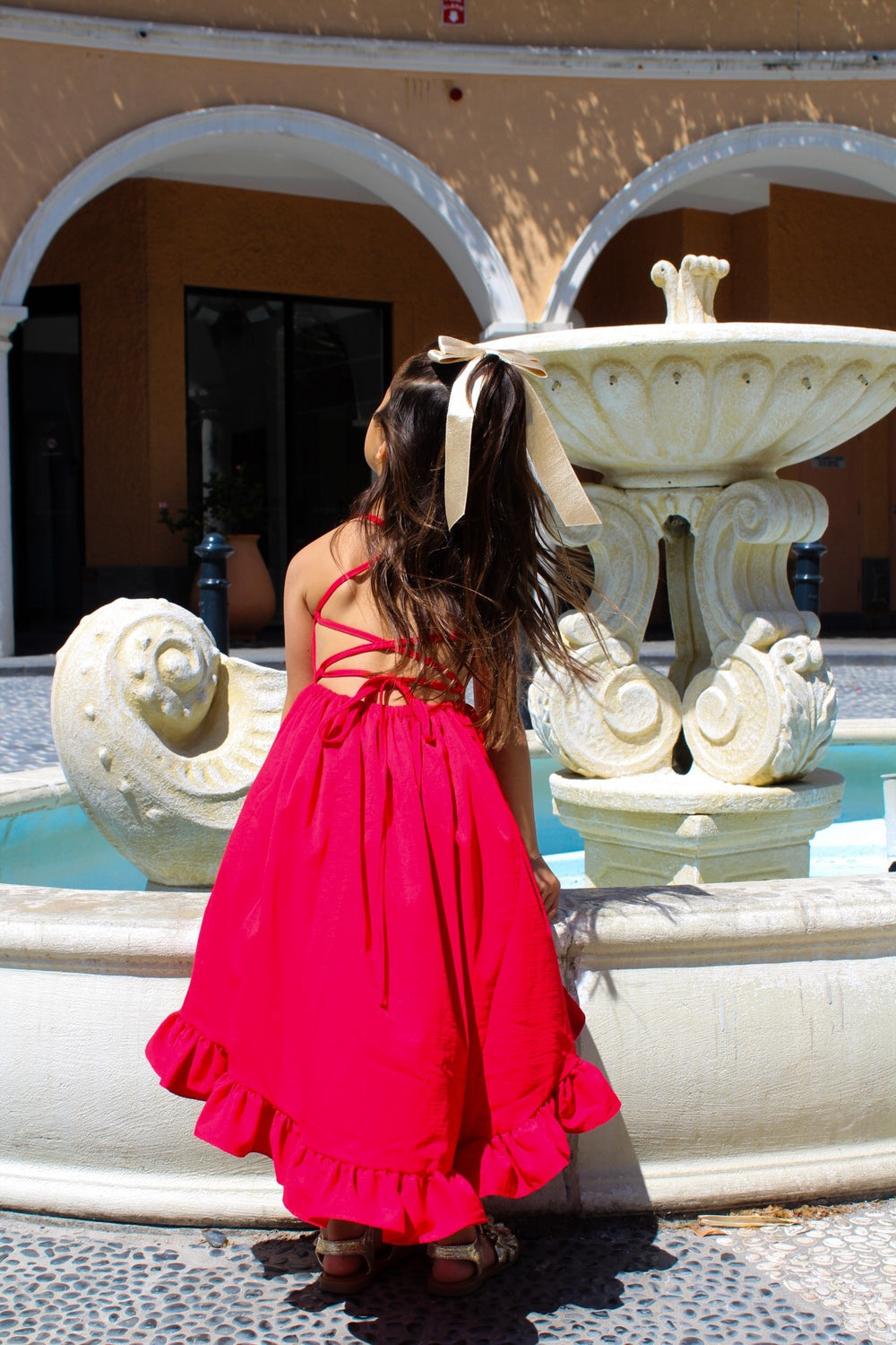 Mia Red Christmas Dress - Christmas Dresses and RompersBack of Mia girls dress with strappy cross-back design