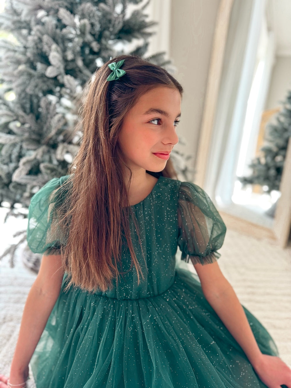 Green holiday hair accessories for girls laid flat