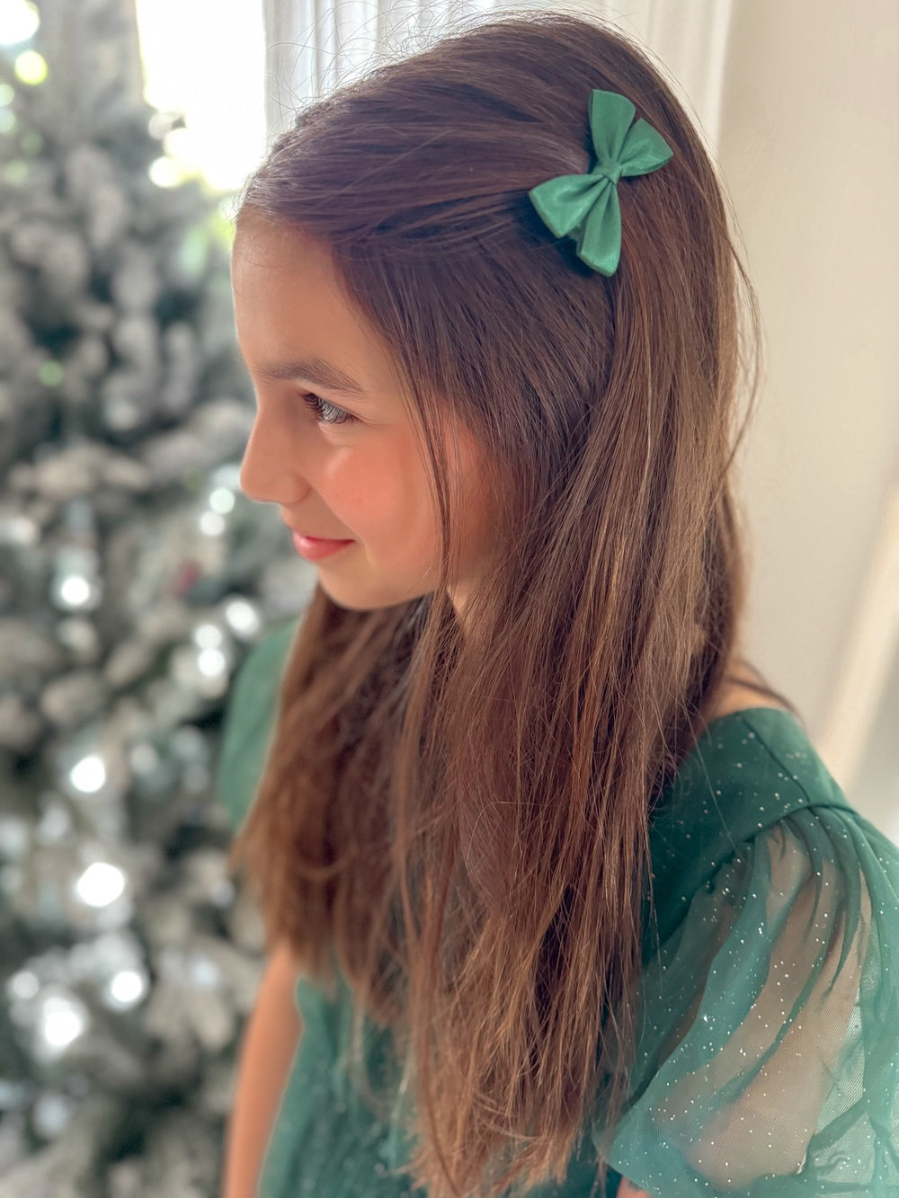 Close-up of green grosgrain ribbon Christmas hair bows