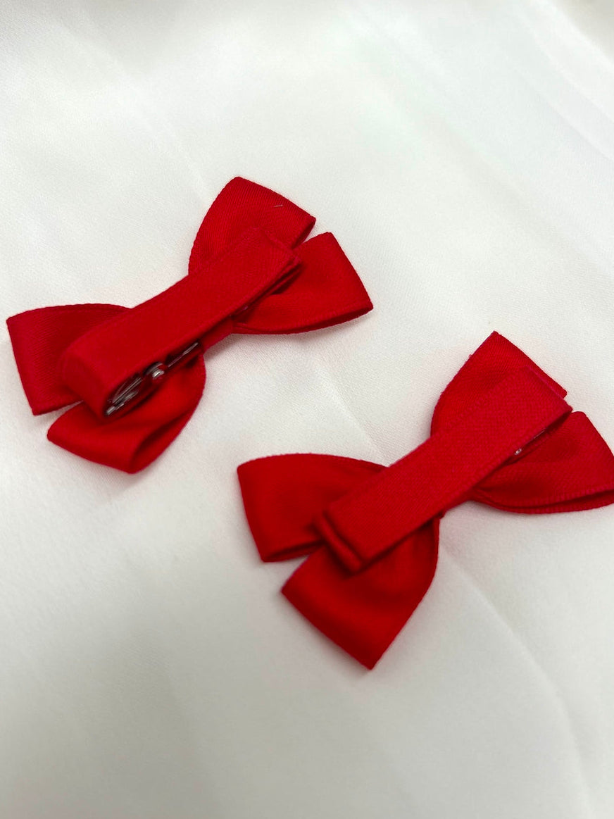 Mini Red Christmas Girls Pigtail Bows - All AccessoriesClose-up of red grosgrain pigtail bows for toddlers