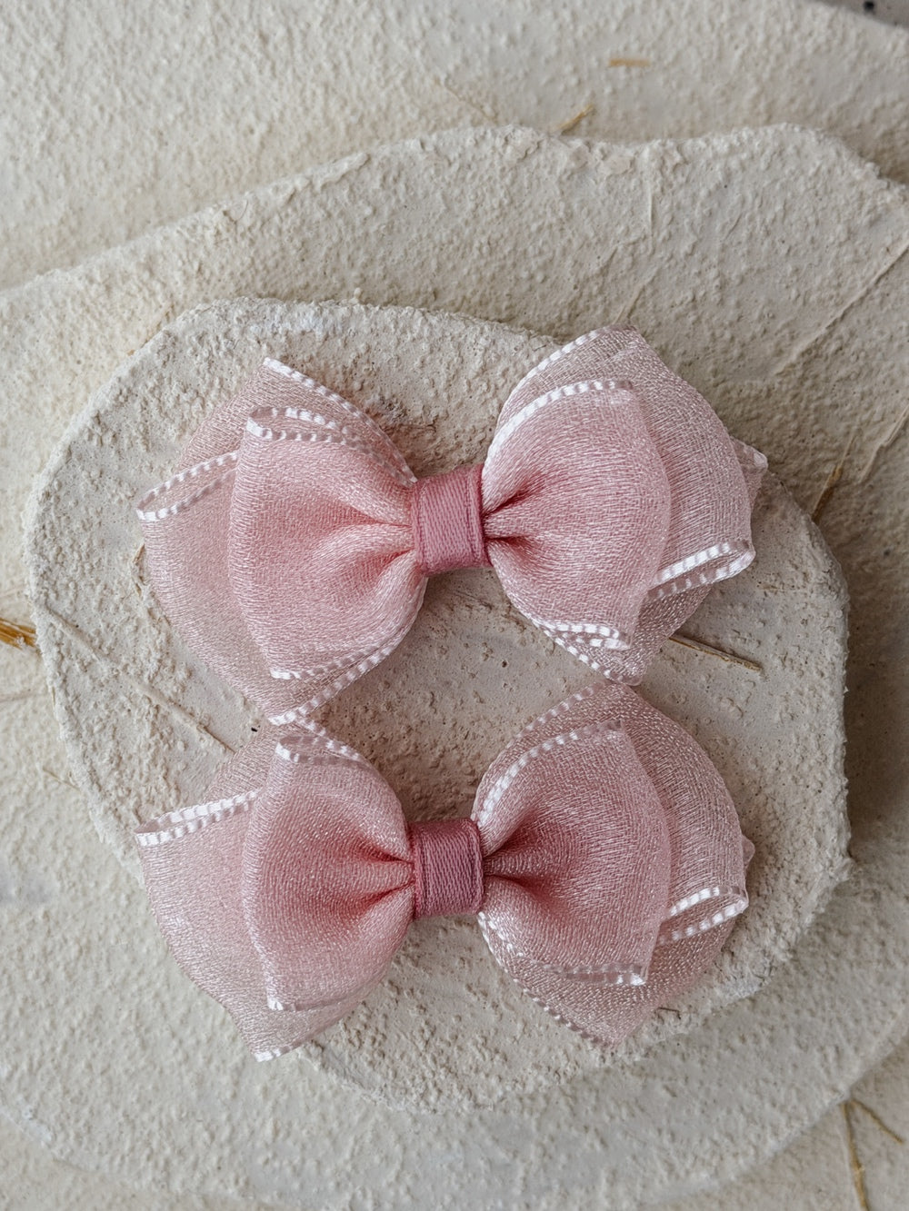 Set of two dusty pink bow hair clips