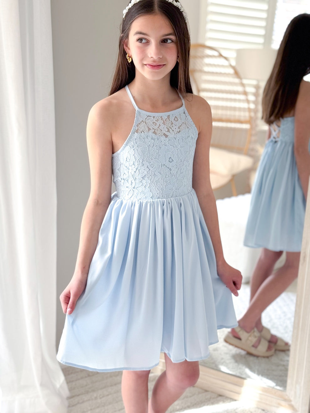 Elegant light blue dress with puff sleeves and soft flowing skirt
