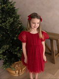 Girls red sparkly Christmas party dress modelled from the front