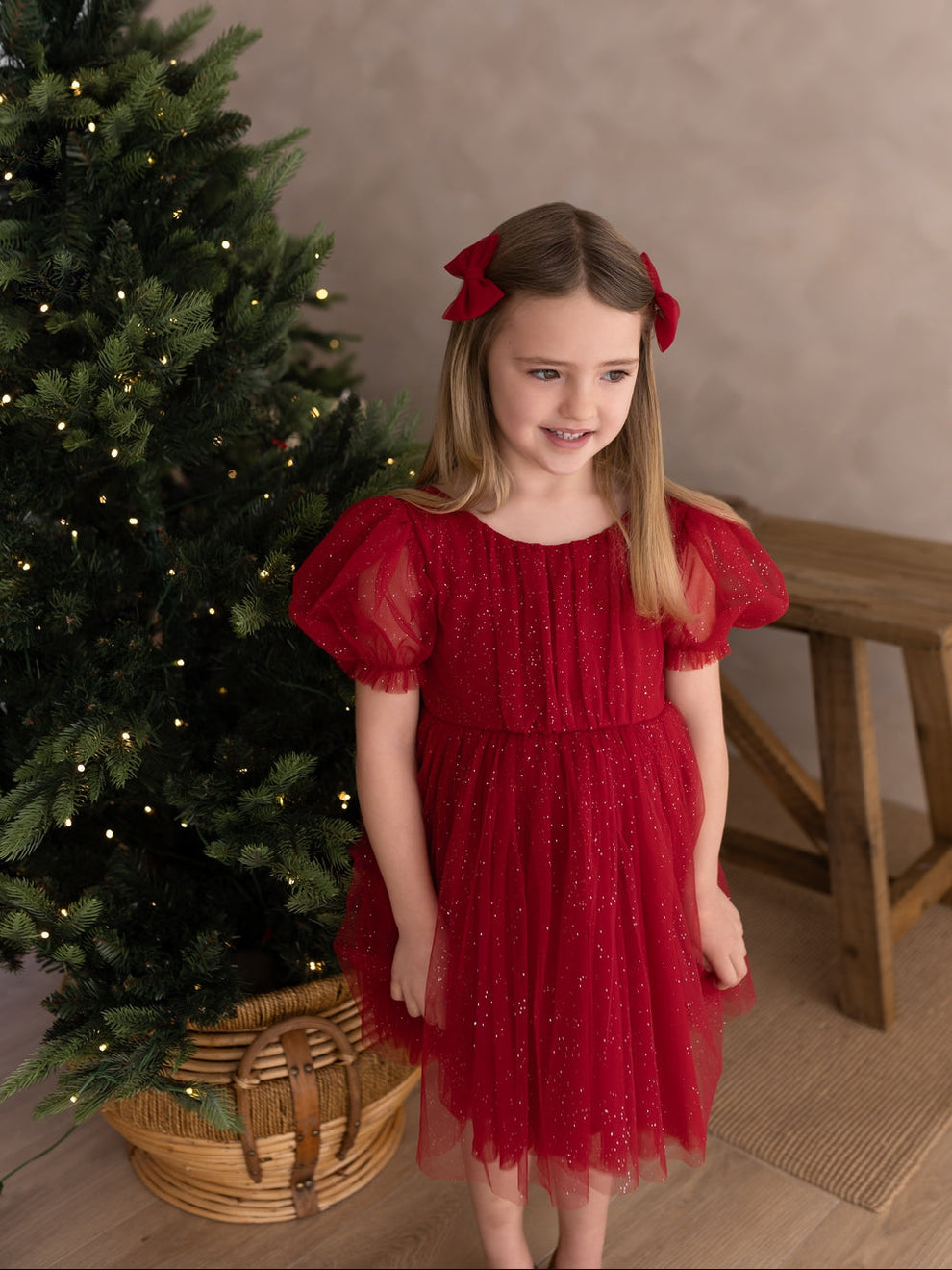 Girls red sparkly Christmas party dress modelled from the front