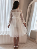 Close-up of lace bodice and bell sleeves on the Odette white dress.