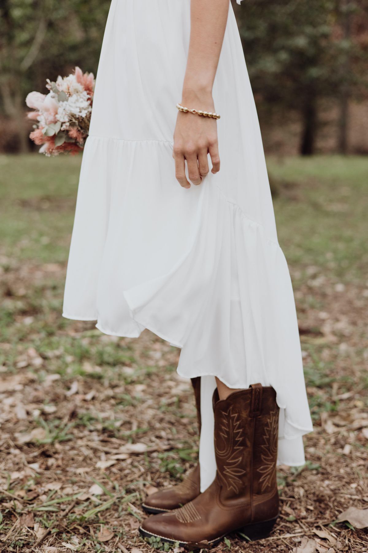 Girls white chiffon junior bridesmaid dresses with Ariat boots 