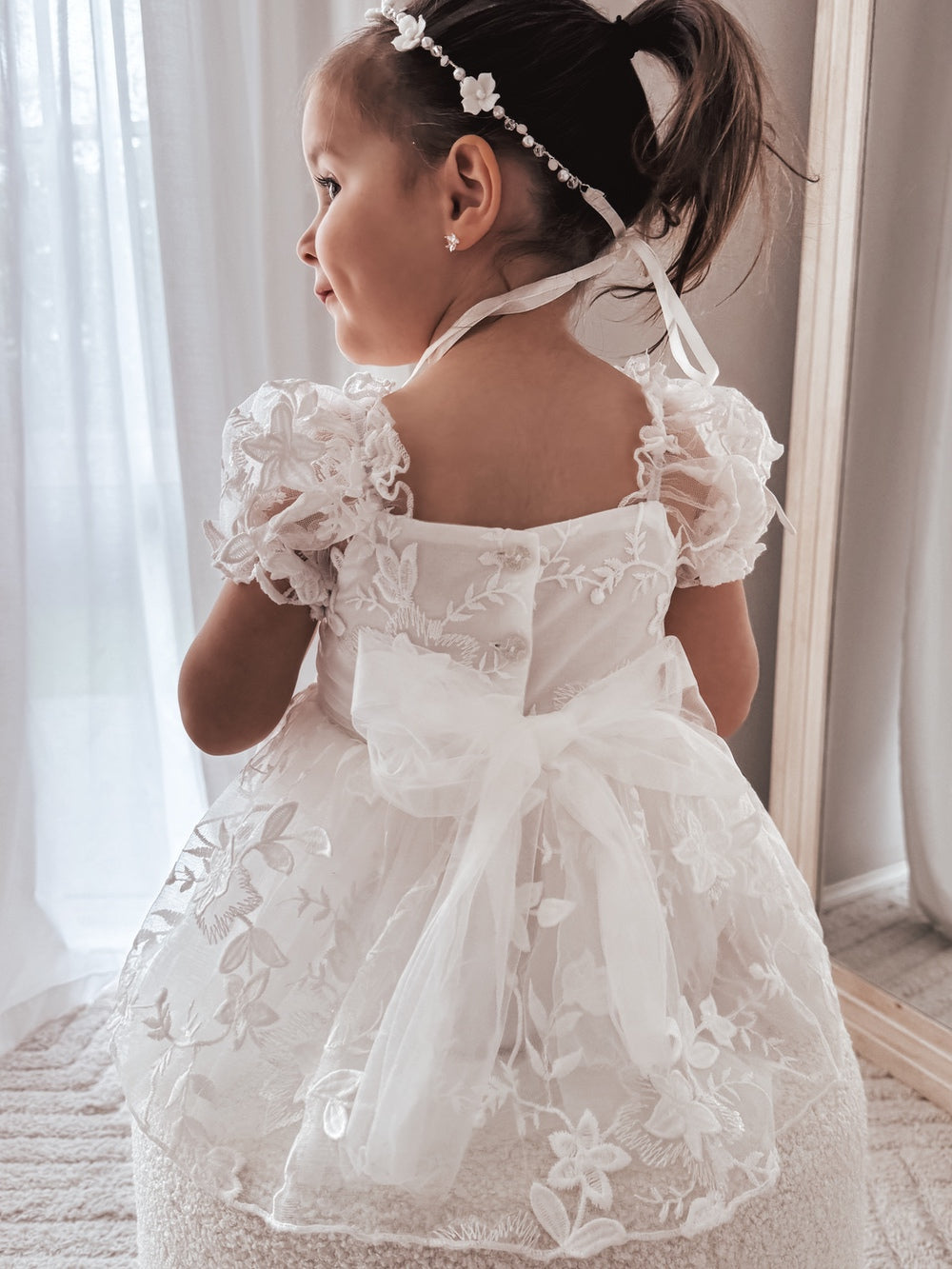 Petal White Embroidered Baby DressBack view showing three-button closure and tulle bow – Petal White Embroidered Baby Dress