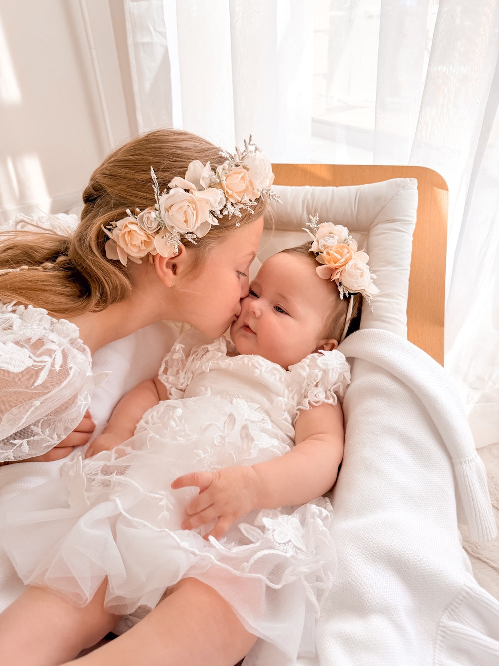 Petal baby romper with soft tulle overlay and bow back