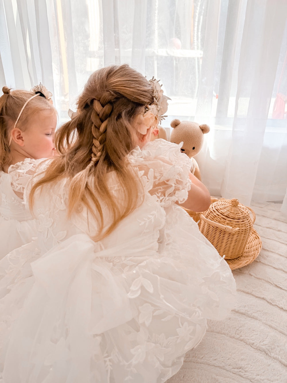 white flower girl dress with embroidered bodice and skirt